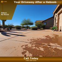 Concrete driveway in Gilbert AZ with monsoon haboob dust staining before pressure washing